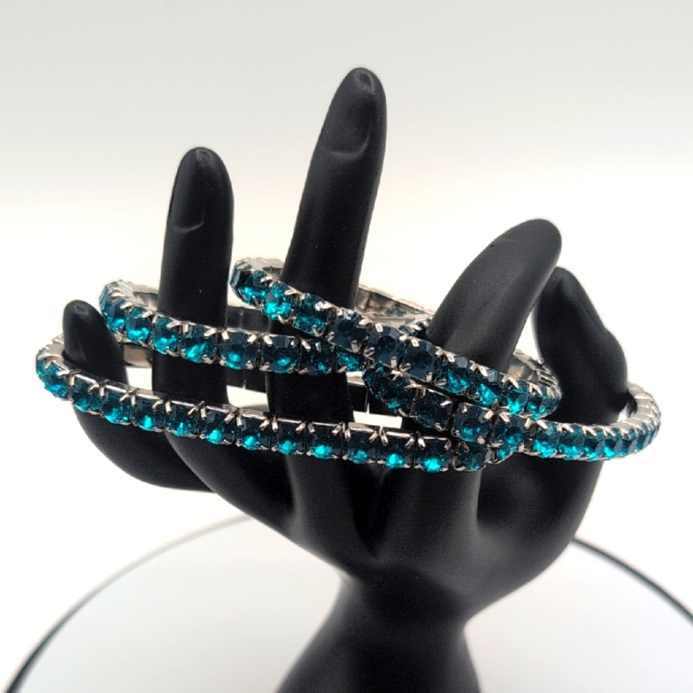 Four Elegant Silver Toned Metallic Bracelets With Aquamarine Blue Stones